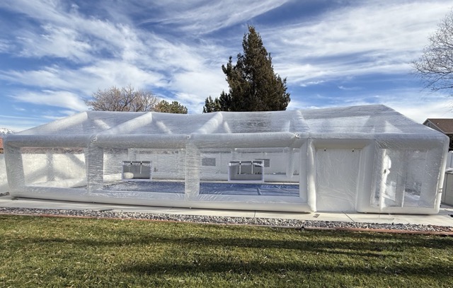 Final anchoring of inflatable pool dome for wind stability