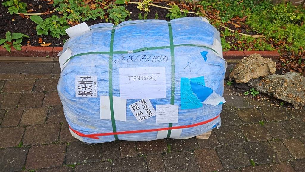 Inflatable pool dome securely packaged for international shipping, ready for delivery to a customer in Europe.