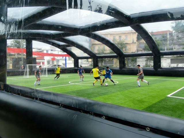 The players are kicking the ball