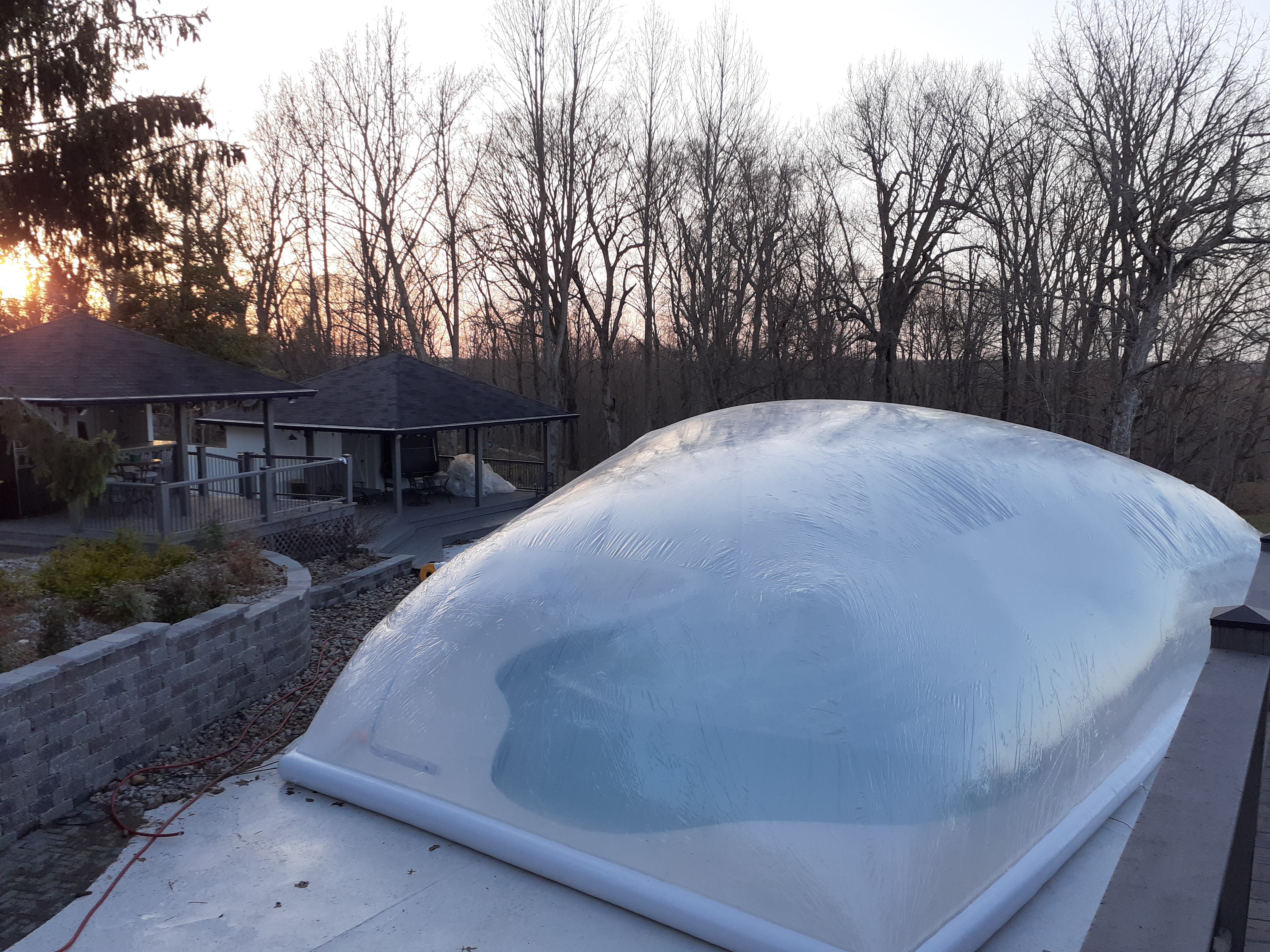 inflatable pool bubble tent installed on outdoor swimming pool